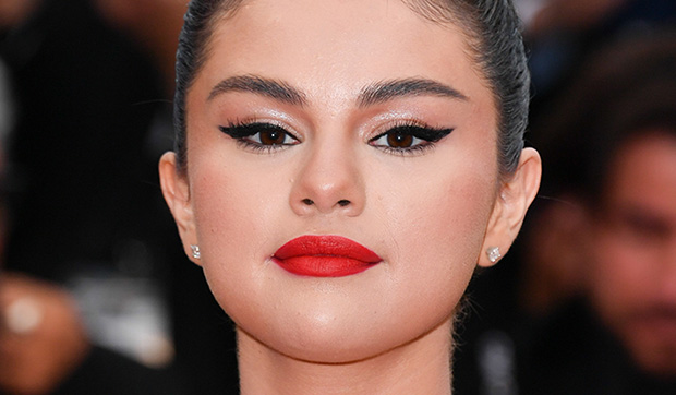 As Selena Gomez trademarks her own beauty line, we reminisce on some of her best looks to date