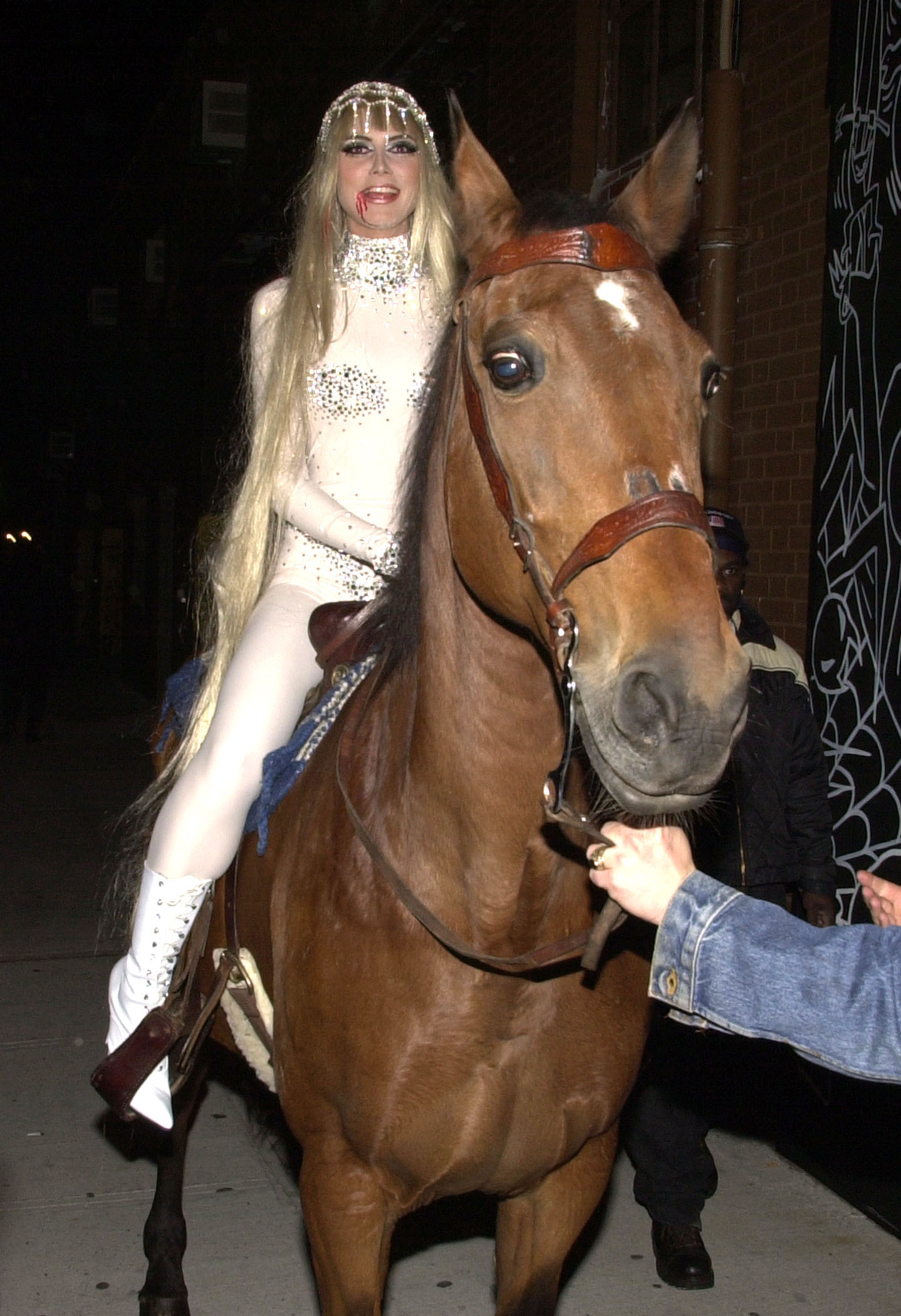 Heidi Klum making an entrance to her party on a horse